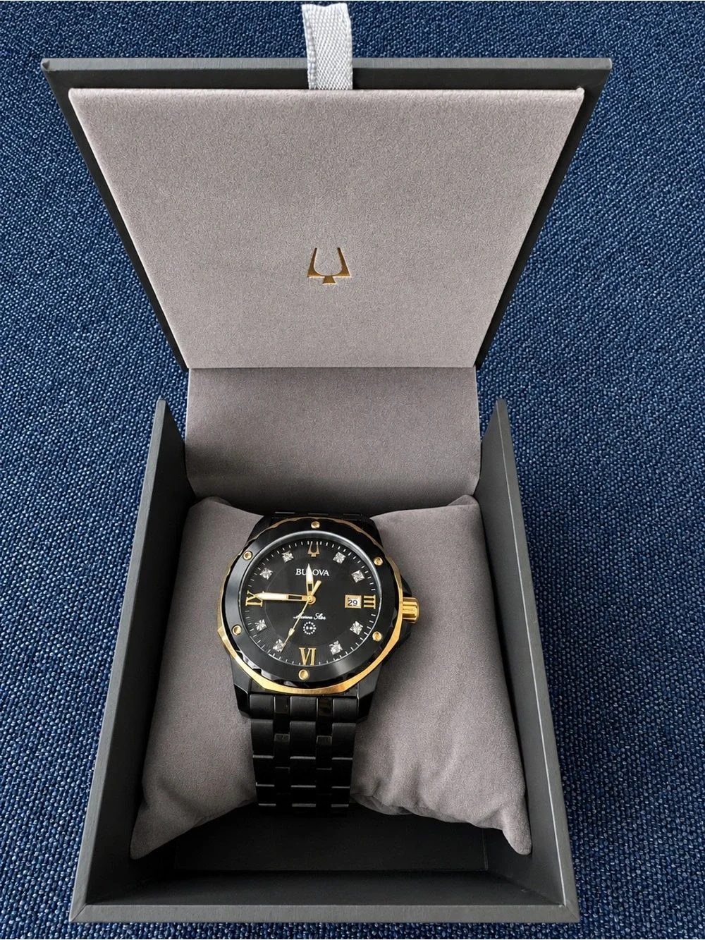 Bulova Black and Gold Ceramic Dress Watch with Crystal Accents